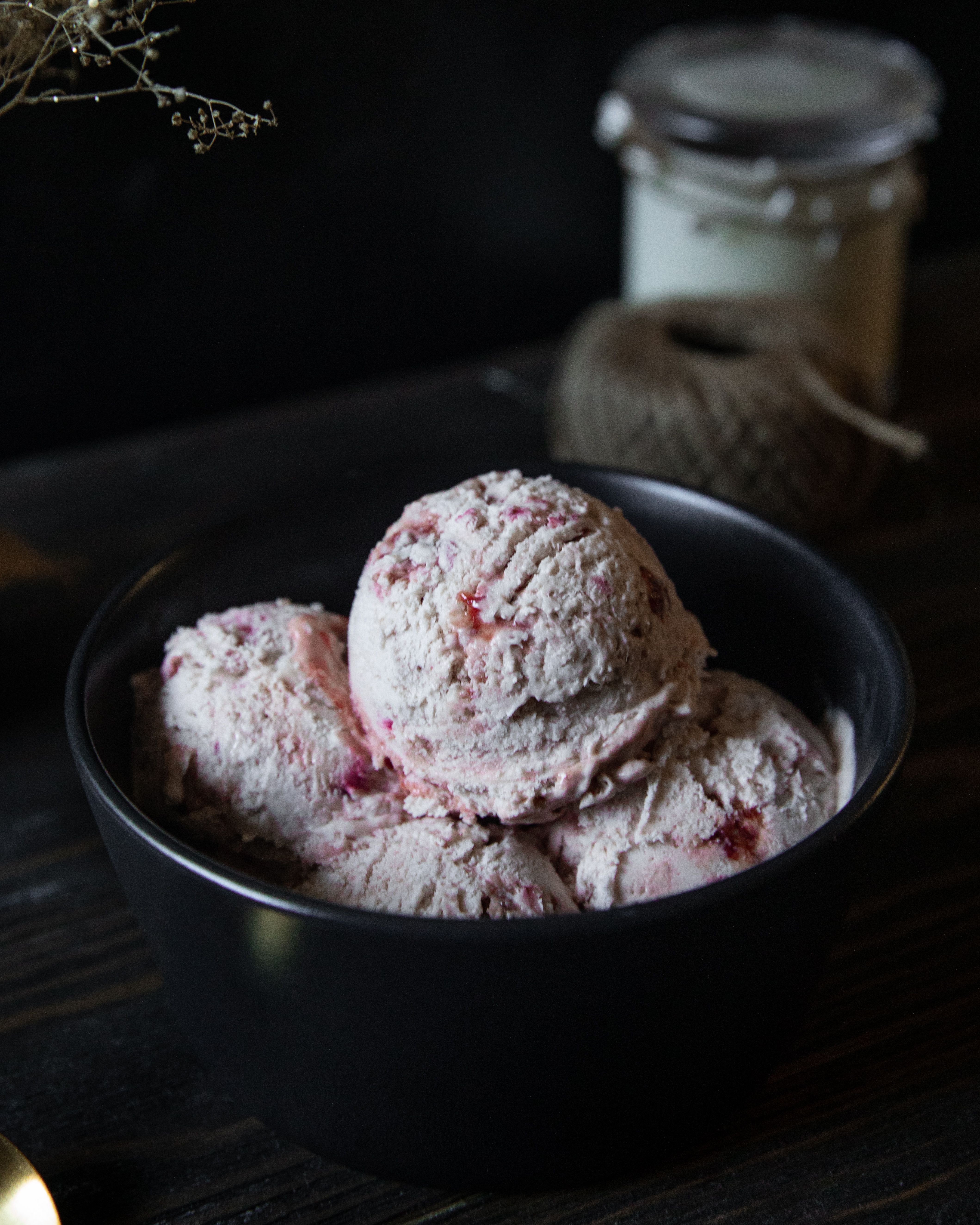 scoops of strawberry balsamic ice cream in a bowl