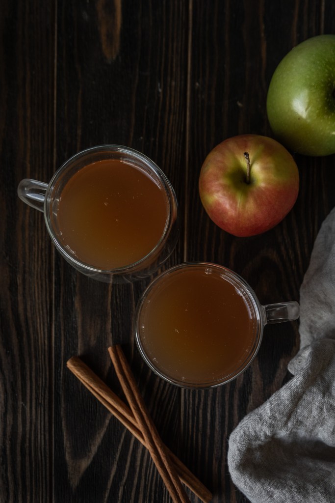 two glasses of hot spiced apple cider